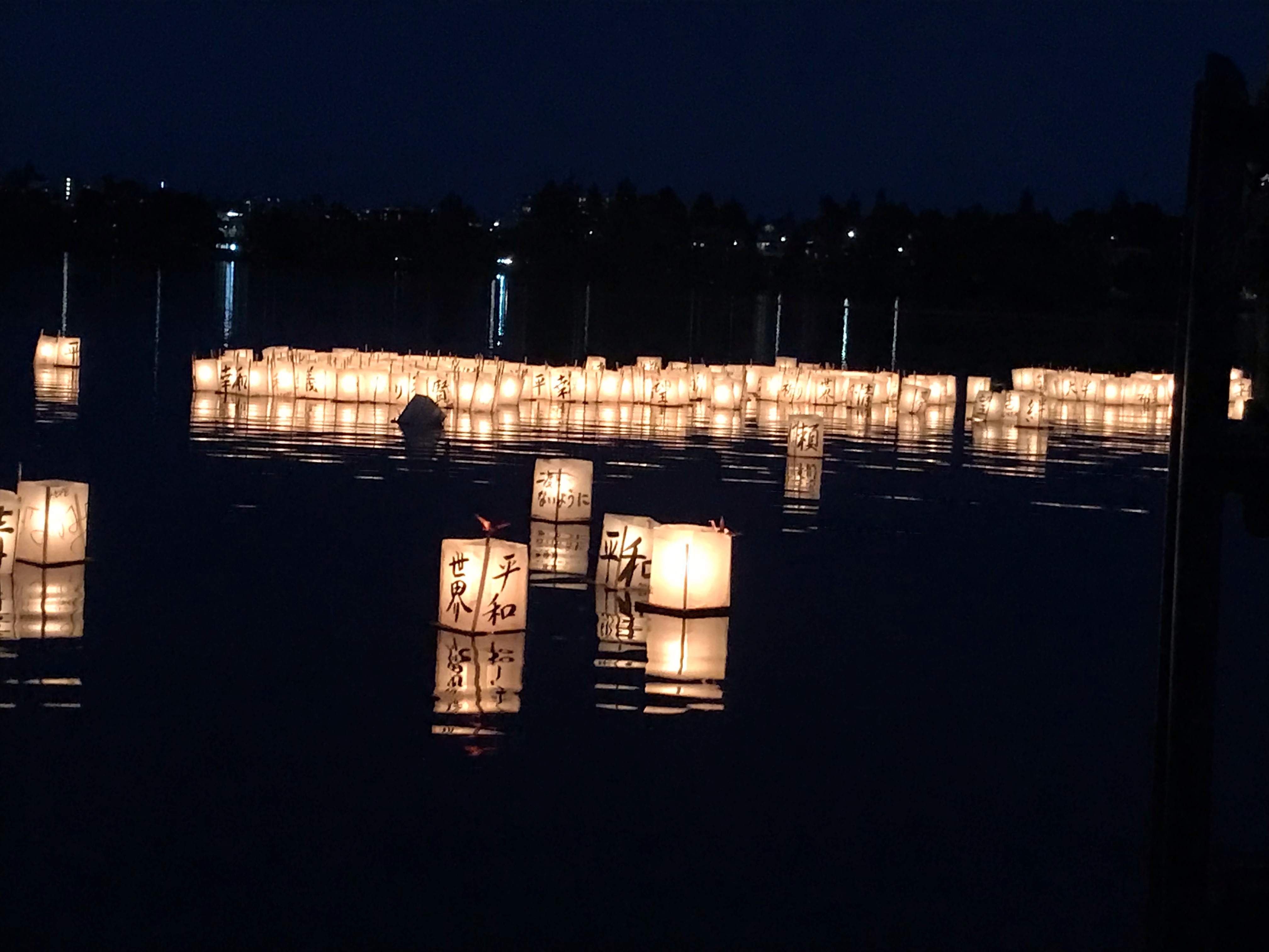 Fh2h lantern closeup Lanterns float on a dark lake